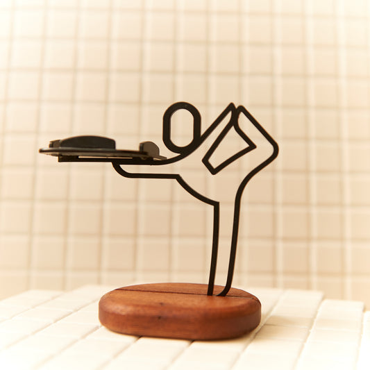 Handcrafted Baby Dancer Pose candle holder made of metal and mahogany, symbolizing balance and grace.