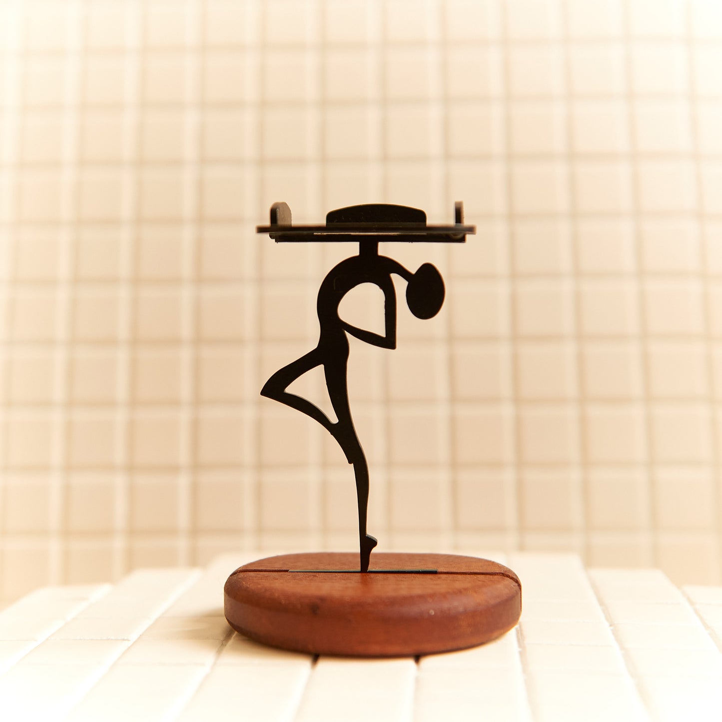 Handcrafted Alien Looking at the Sky candle holder made of metal and mahogany wood.