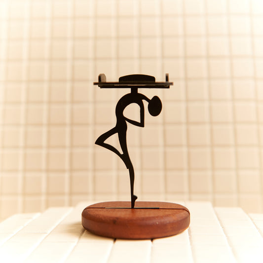 Handcrafted Alien Looking at the Sky candle holder made of metal and mahogany wood.