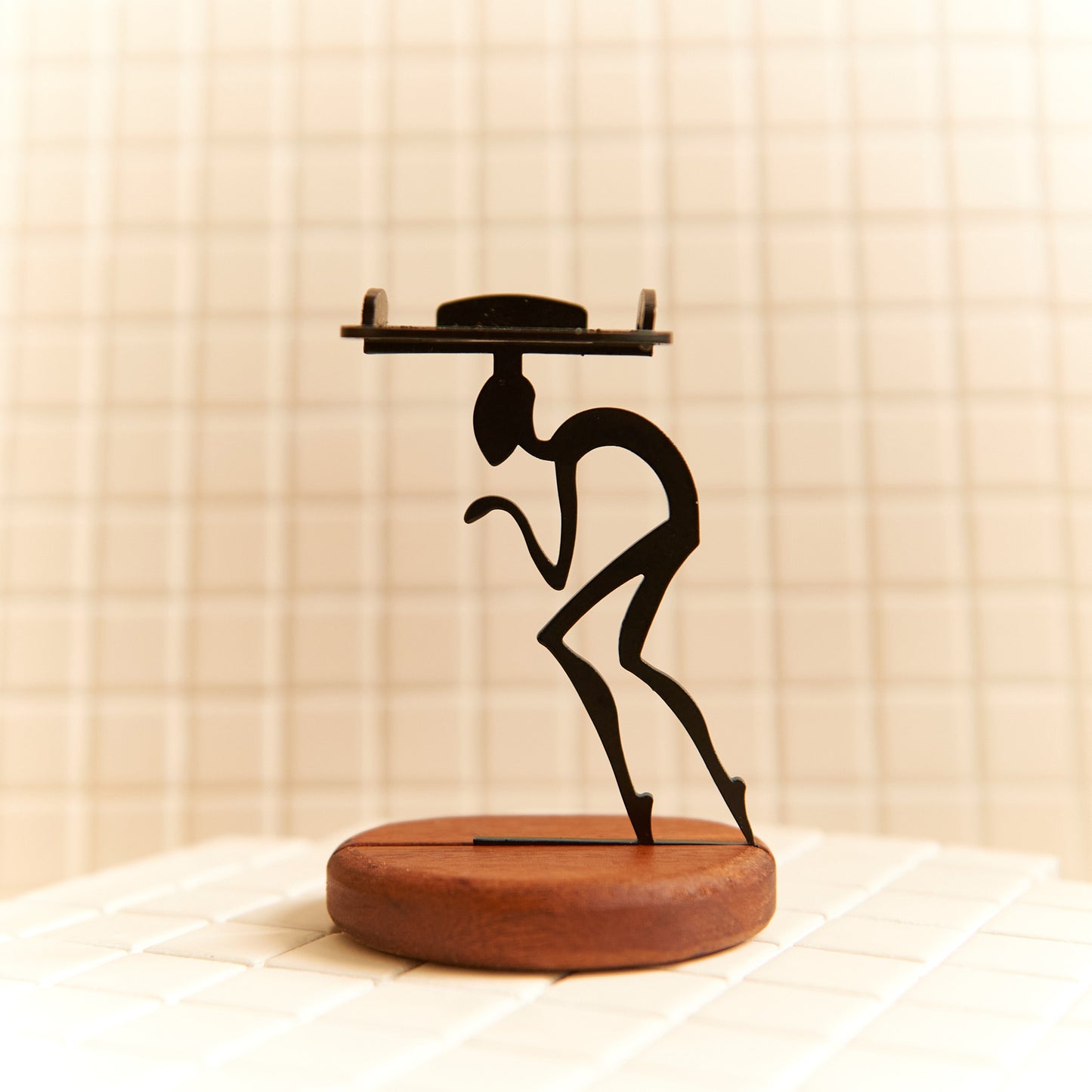 Handcrafted Secret Space Walker candle holder made of metal and mahogany wood.