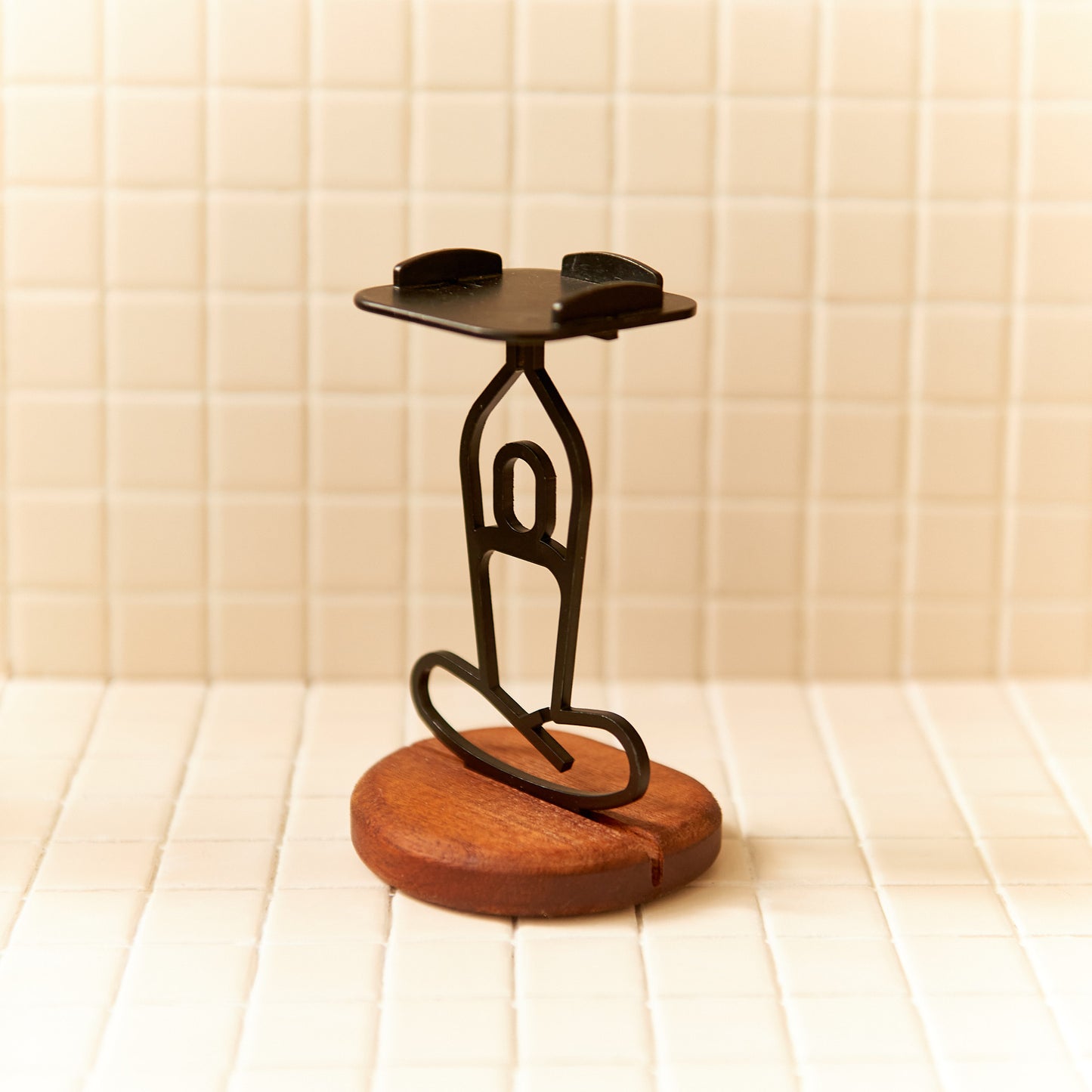 Metal yoga sculpture candle holder with raised arms, handmade decor for meditation.