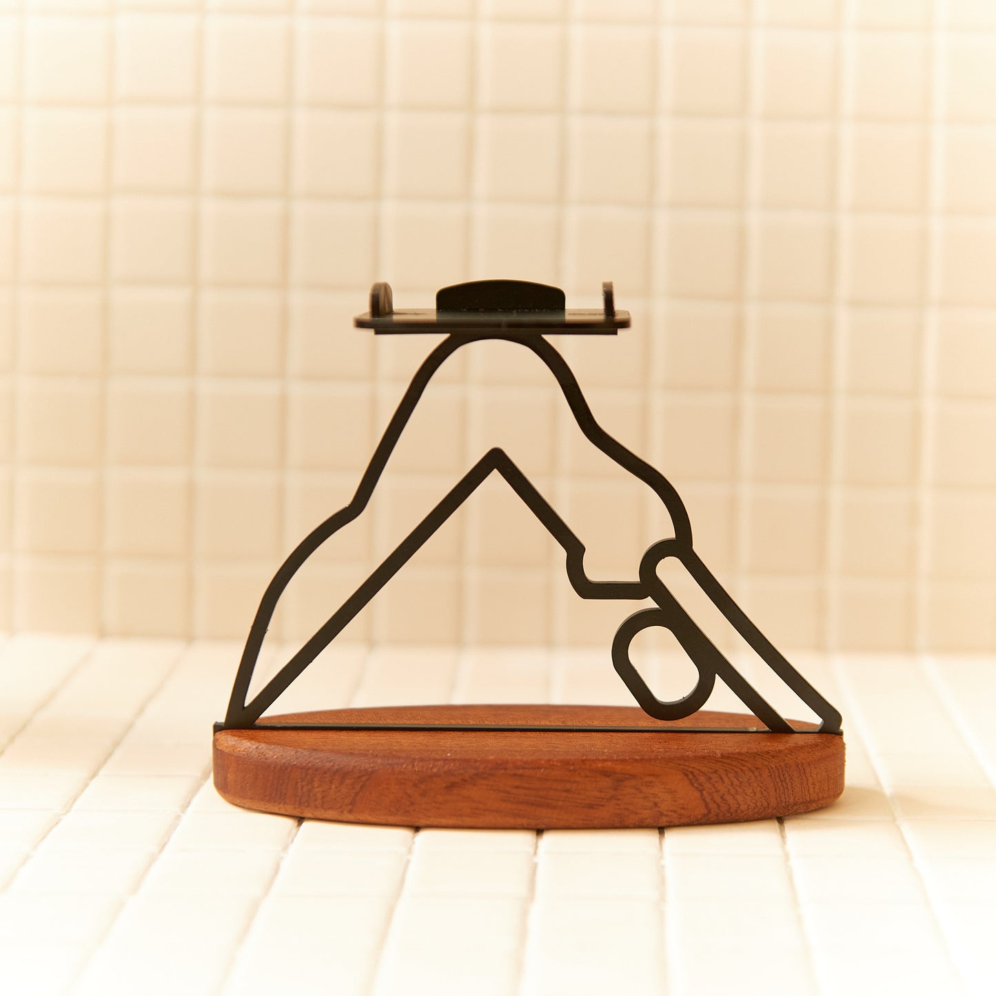 Yoga-inspired candle holder in Downward Facing Dog pose, minimalist handmade decor.