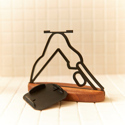 Close-up of Downward Facing Dog candle holder, handcrafted modern design.