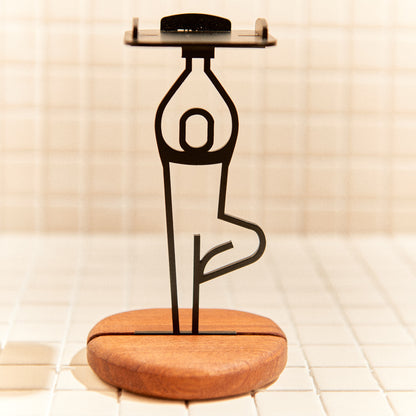 Metal Tree Pose sculpture on mahogany base, handcrafted art for yoga spaces.