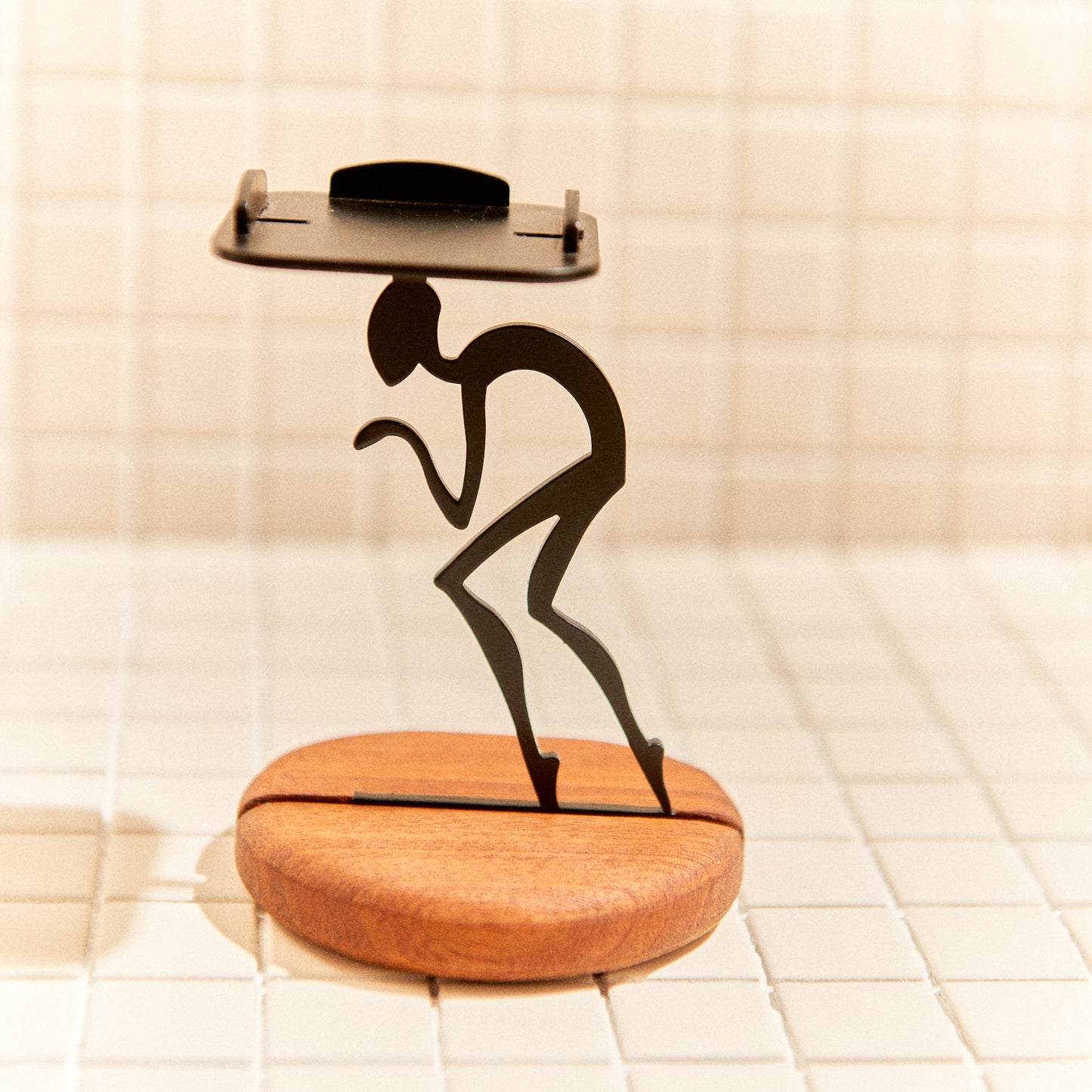 Minimalist alien figure candle holder, handmade decor inspired by space exploration.