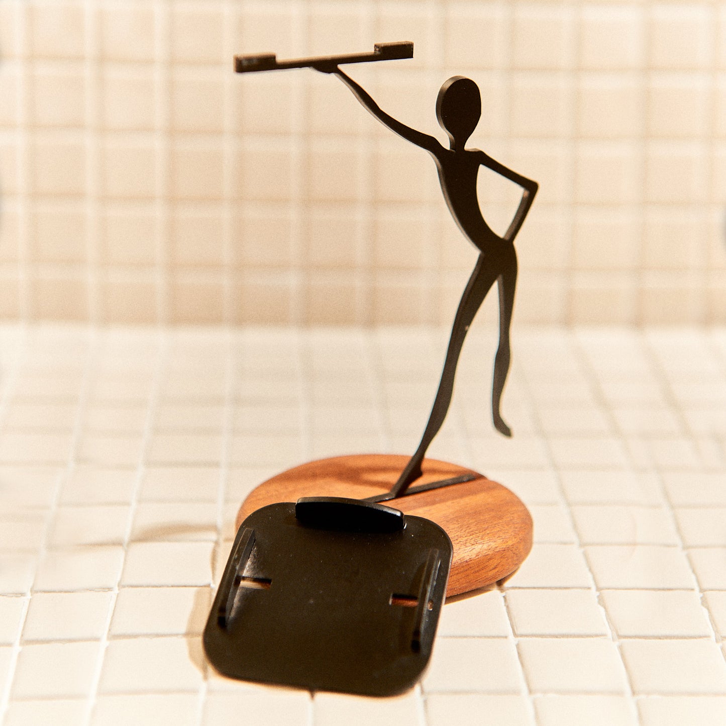 Modern handcrafted metal decor on mahogany base for tealight candle.