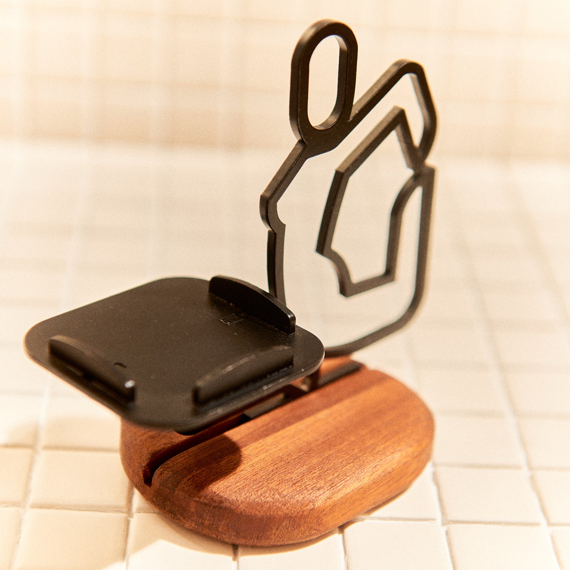 Metal Mermaid yoga sculpture on mahogany base, elegant handcrafted art for calm spaces.