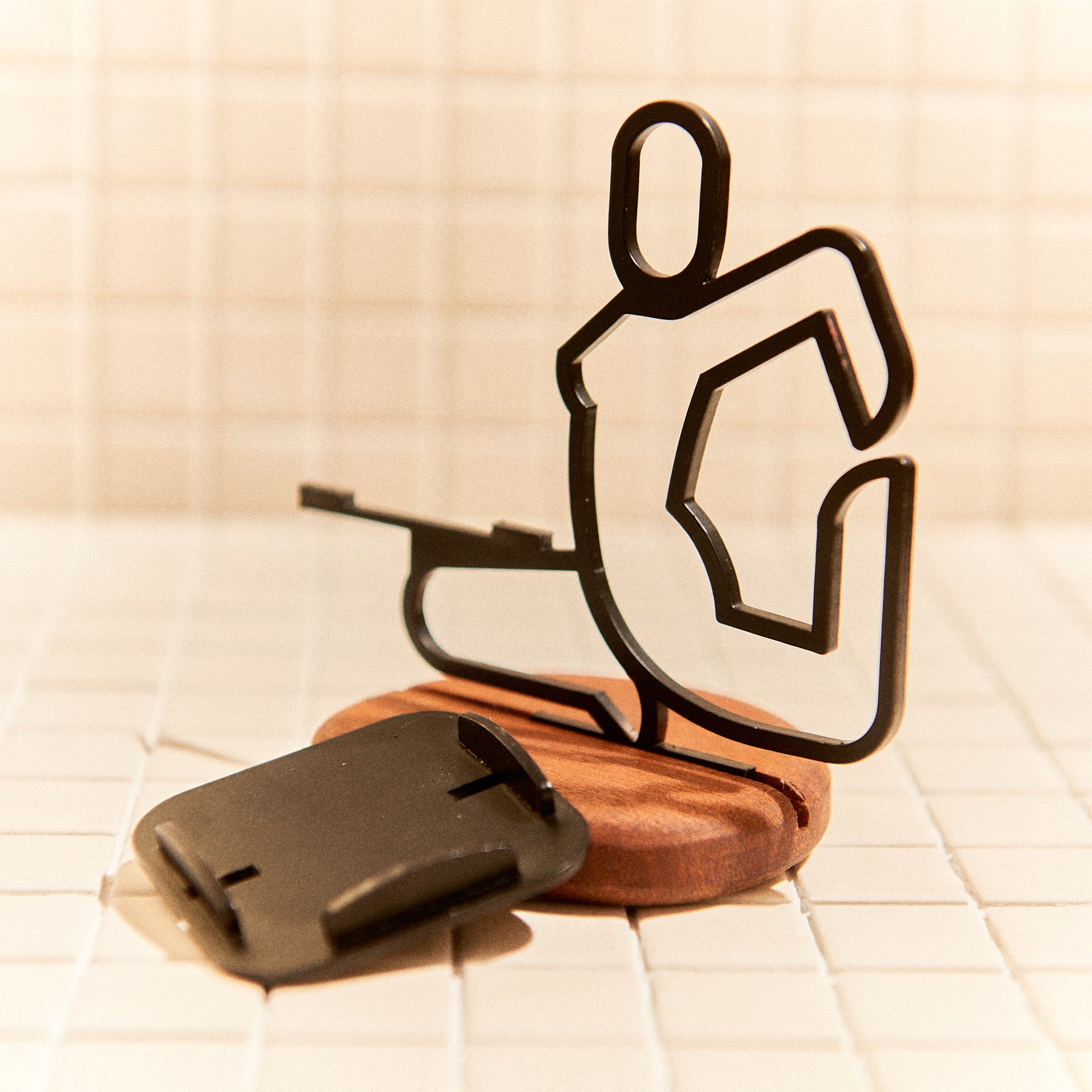 Close-up of Mermaid Pose candle holder, metal figure with wood base, boho home decor.