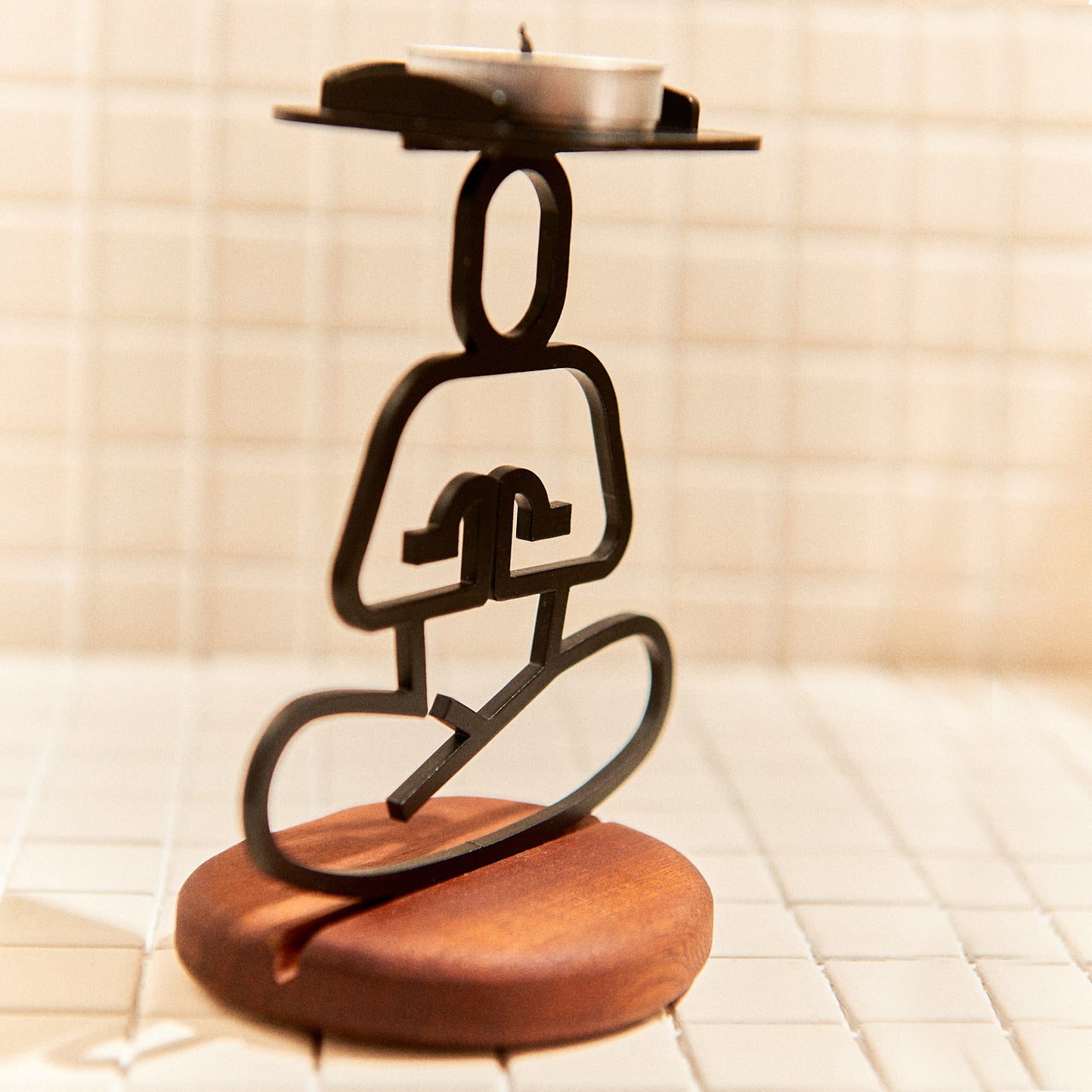 Metal Ardha Lotus Pose sculpture on mahogany base, perfect for yoga or meditation spaces.