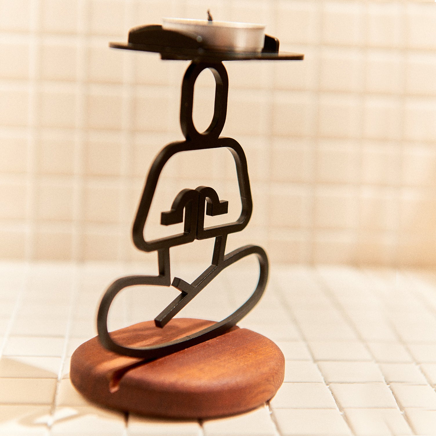 Metal Ardha Lotus Pose sculpture on mahogany base, perfect for yoga or meditation spaces.