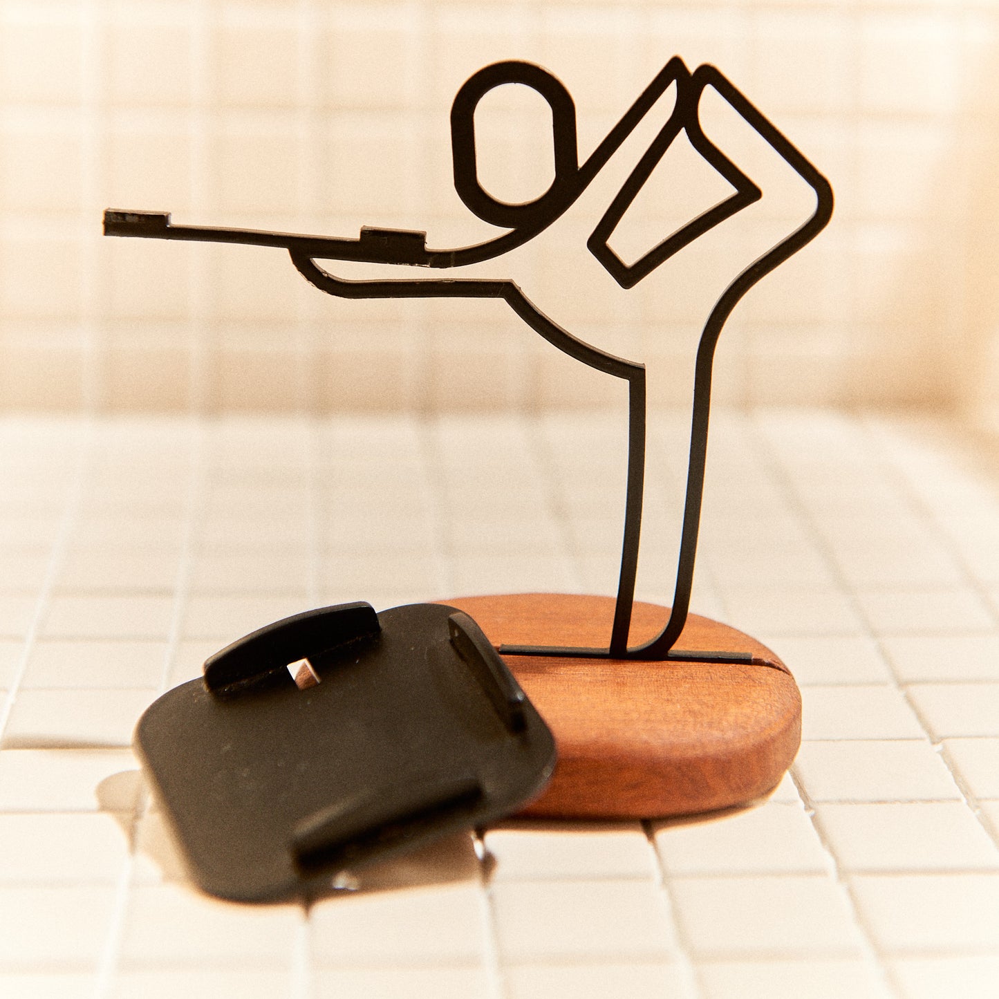 Close-up of handcrafted candle holder, Baby Dancer yoga posture, elegant modern decor.